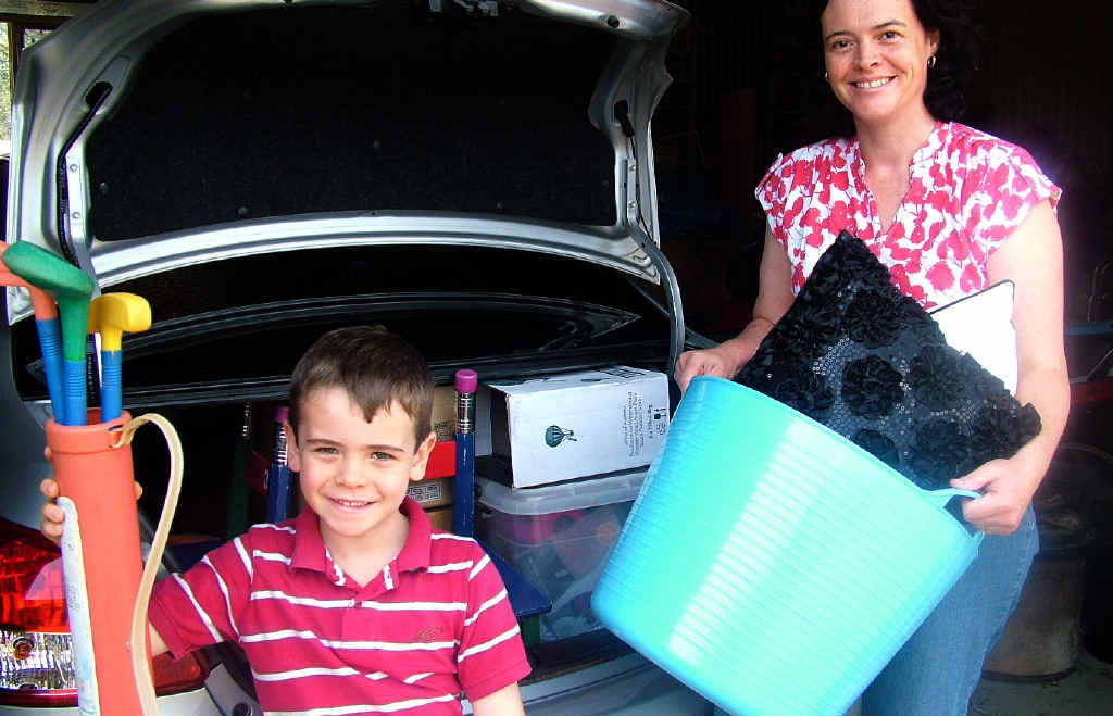 JUMBO JUMBLE SALE: Catherine Dunn and son Peter prepare for the jumble sale stall at Allora this weekend.